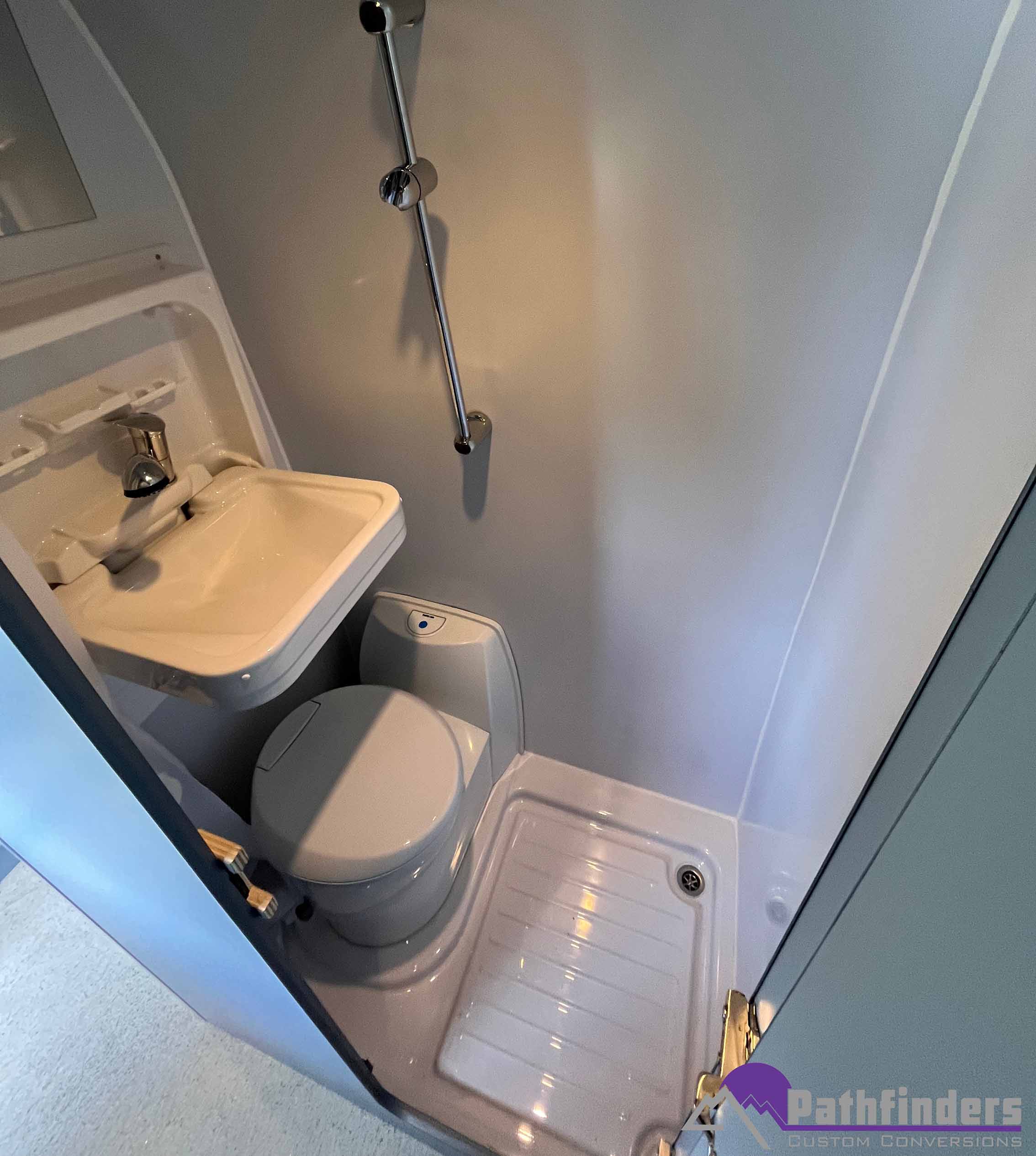 custom built bathroom with sink and toilet