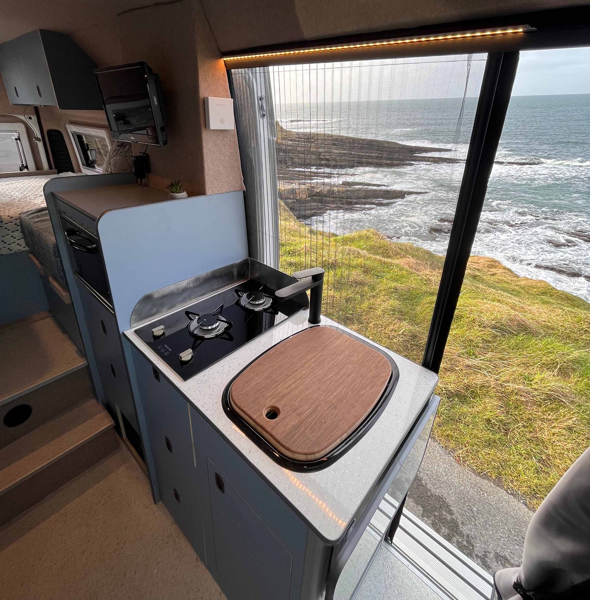 kitchen unit with fly cover up behind it