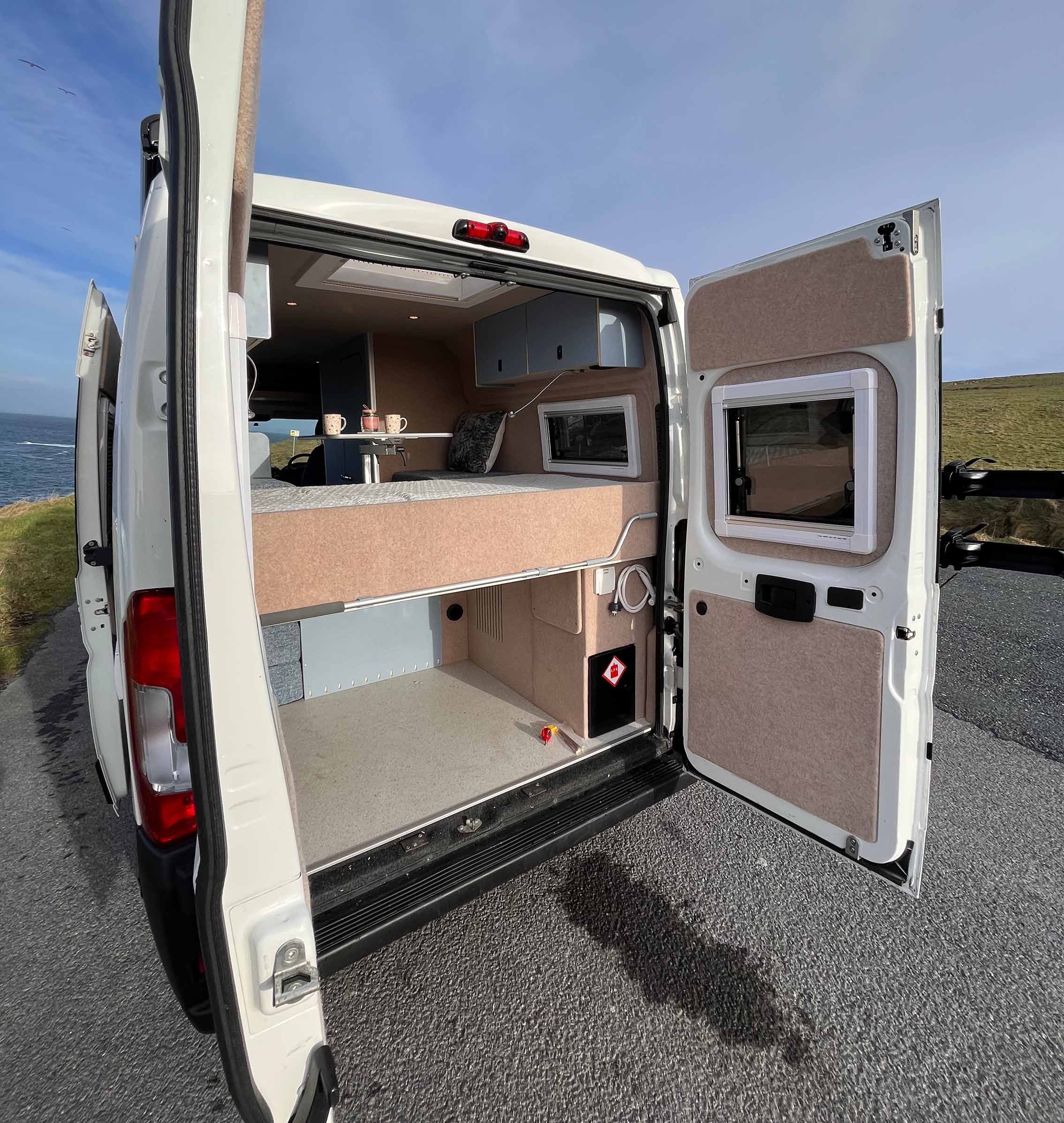 back doors open of van with a view inside the van
